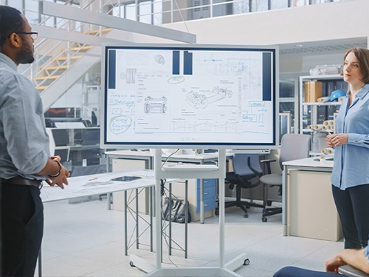 People standing around in an office